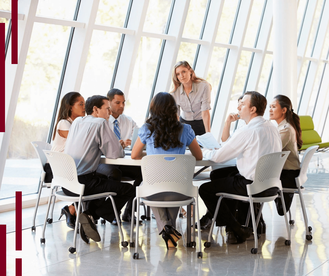 A group of people sitting around a table.